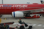 Baggage handlers waiting to handle our suitcases at MEL/YMML.